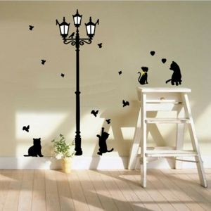Fekete cicák a lámpa alatt öntapadó dekoráció